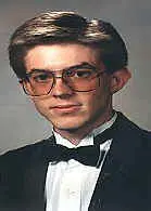Formal attire with large glasses