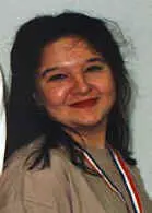 Woman wearing a medal, smiling