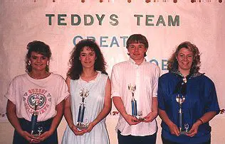 Group posing with awards in front