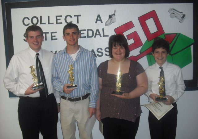 Award winners standing with trophies