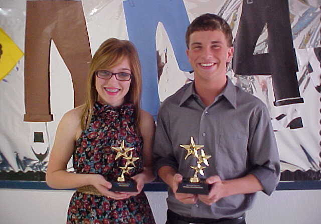 Young winners with star-shaped trophies
