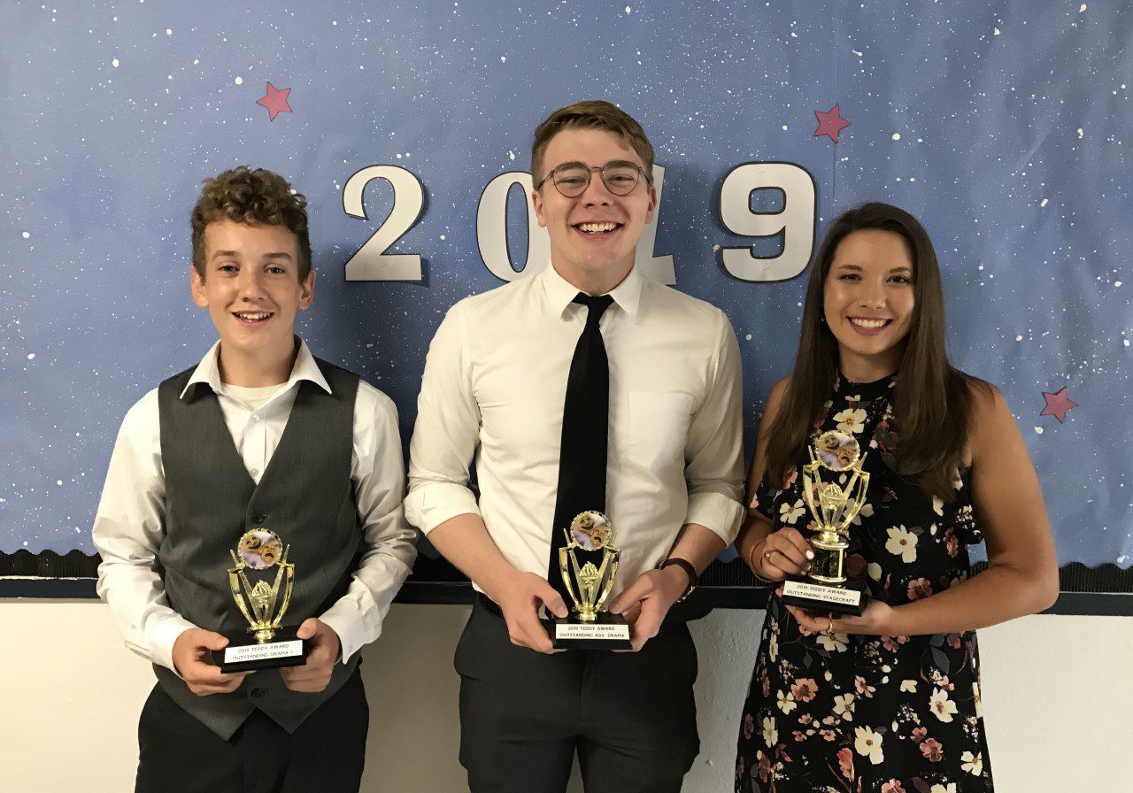 Award winners in front of 2019 sign