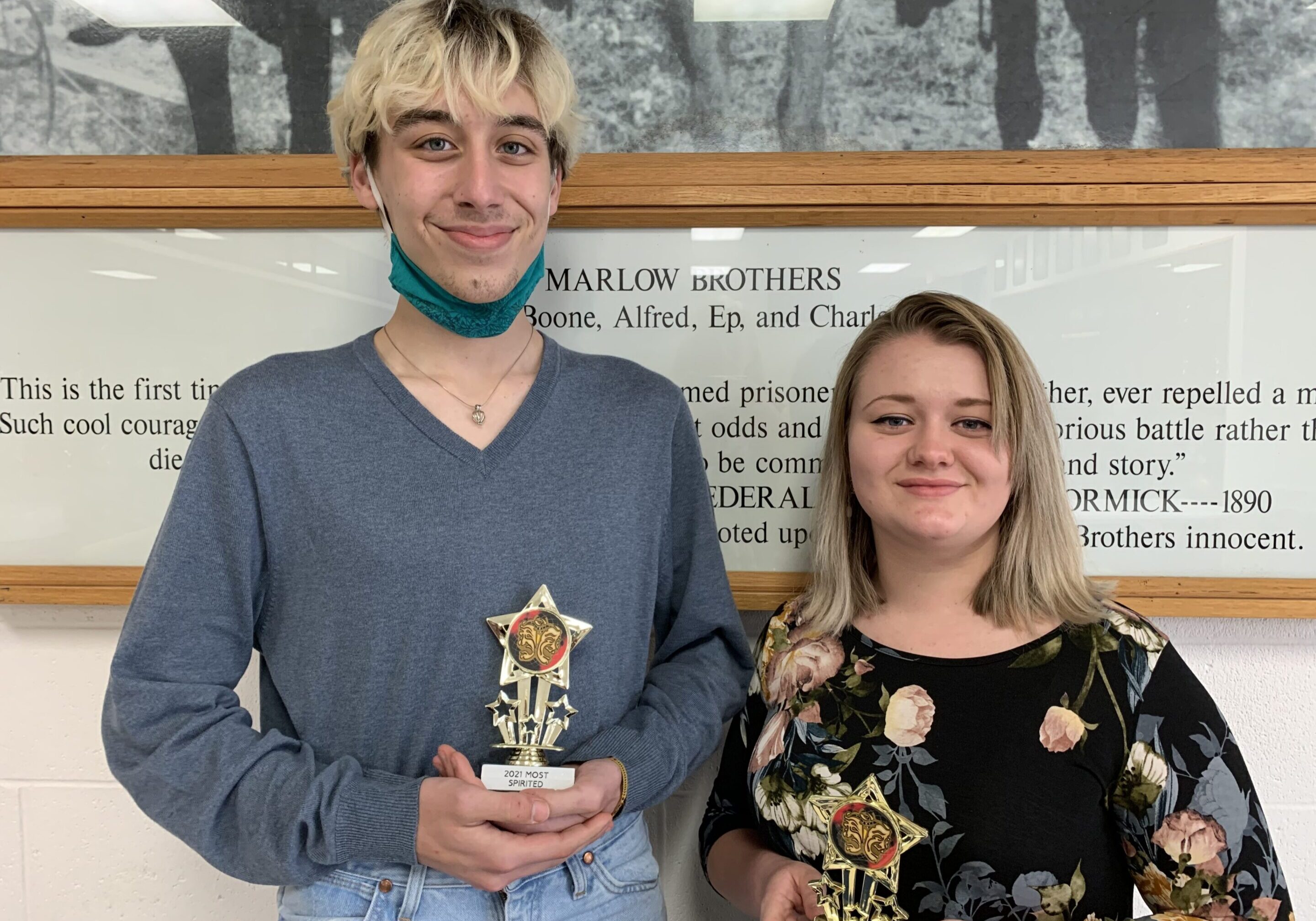 Celebrating achievement with trophies in hand