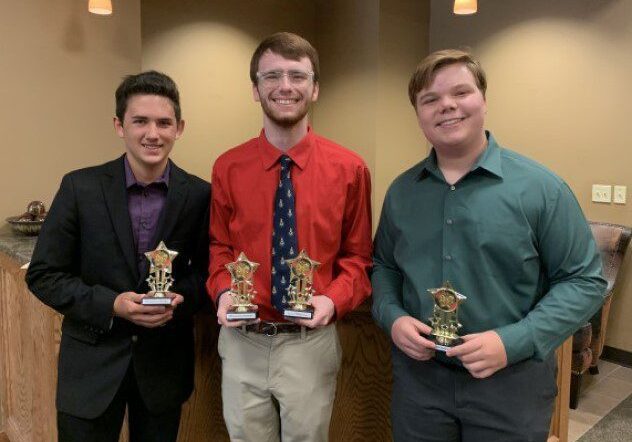 Group of three with award trophies